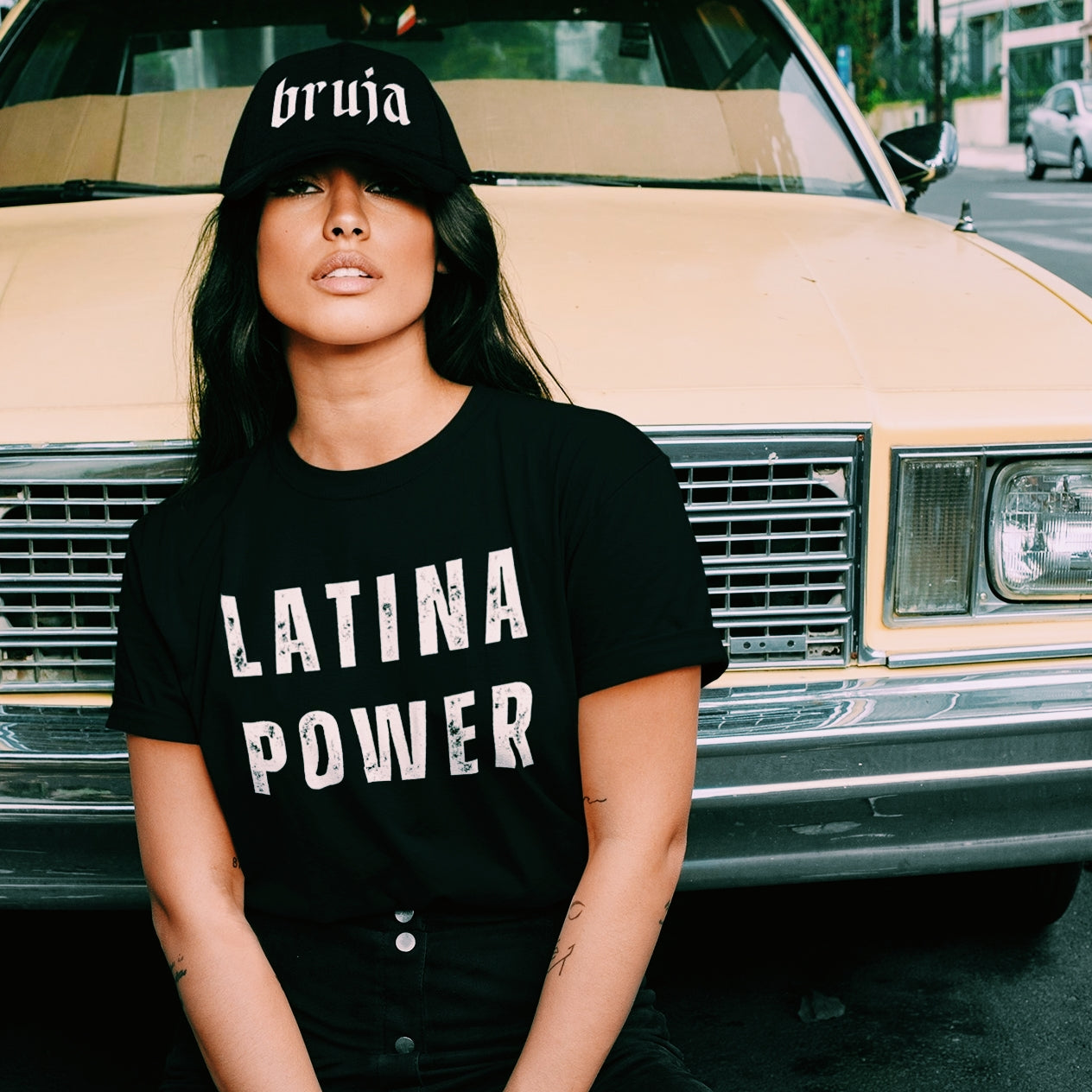 Latina wearing a black t-shirt with the words "Latina Power".  Gift for Latinos, Hispanics, and Mexican-Americans