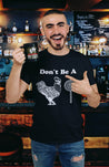 Latino man wearing a Humorous black t-shirt for men, with a creative rooster and lollipop graphic and message