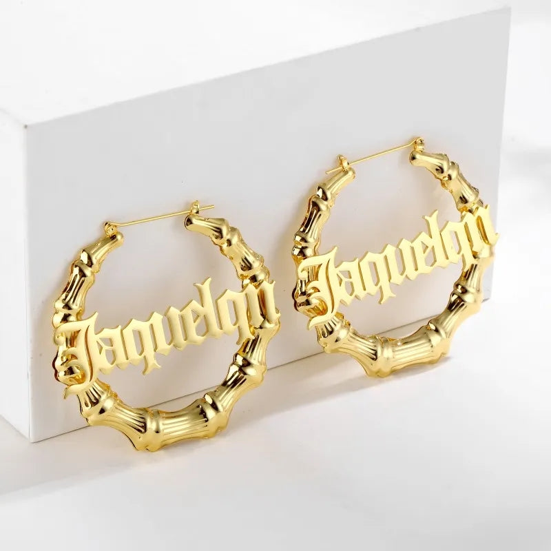 Gold Personalized bamboo hoop earrings for Latinas with custom name in old English font