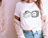 hispanic woman wearing a Fun white t-shirt for Latinas featuring a creative toaster and bread design with the phrases 'te quiero dentro de mi' and 'eso me calienta'