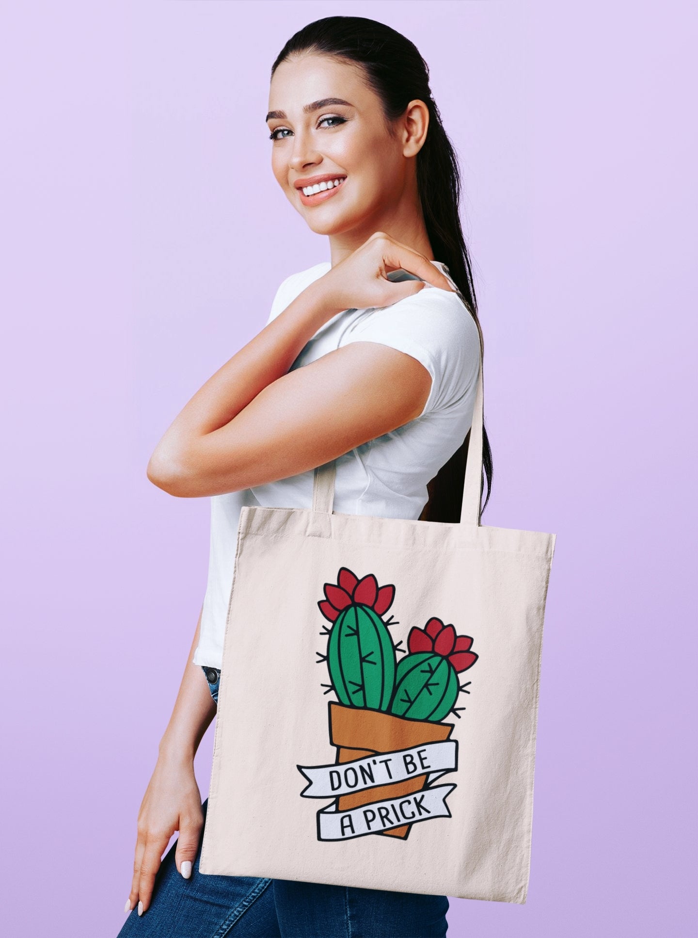 Funny women's canvas tote bag featuring a green cactus in a brown flower pot and the phrase 'don't be a prick'