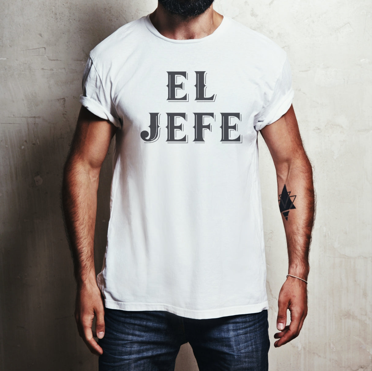 latino man wearing a  White t-shirt with black Old English lettering reading 'EL JEFE'