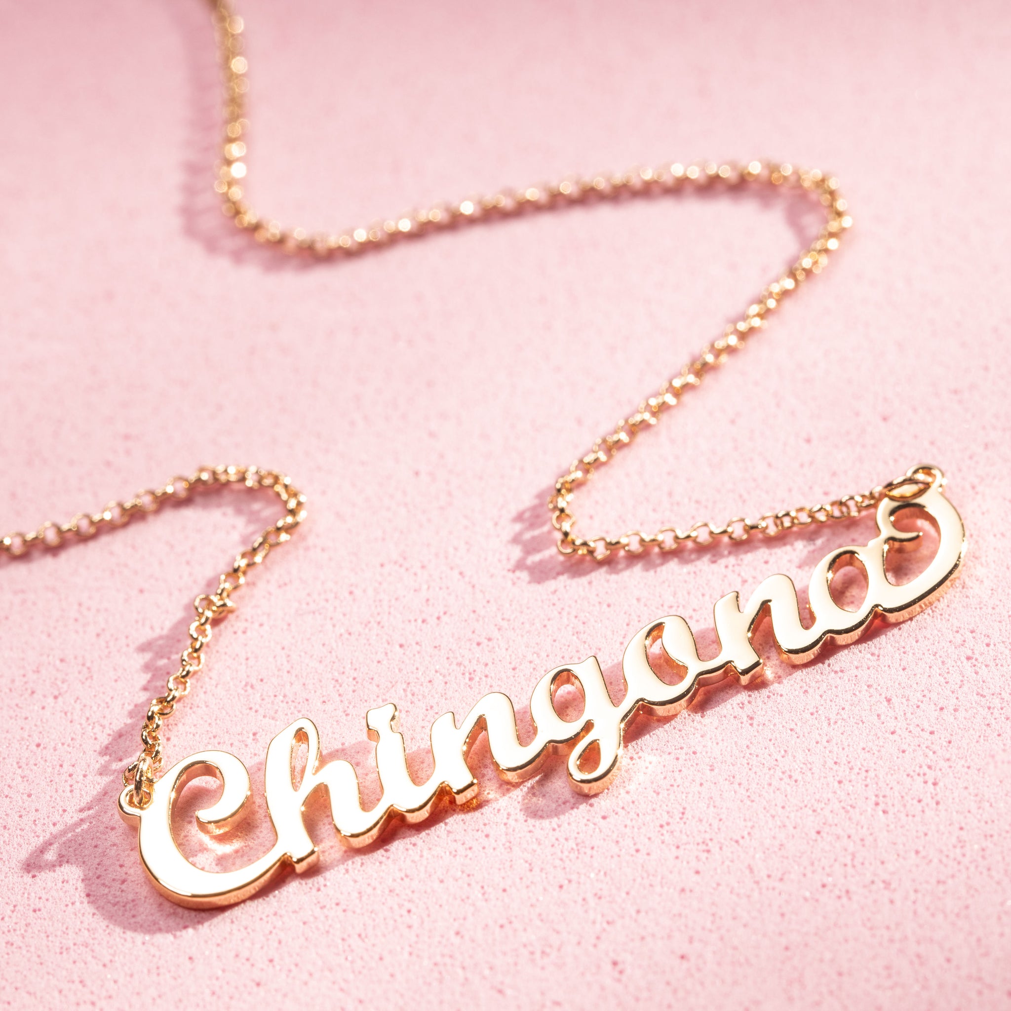 Gold-plated sterling silver necklace for women, showcasing strength and style with the word 'Chingona' written in elegant cursive script