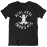 funny black t-shirt for Latino culture. the graphic depicts a frog and the words "heal heal frog's ass" in honor of sana sana colita de Rana
