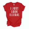 Humorous Latino Streetwear-style t-shirt featuring 'I Just Look Illegal' graphic on red background