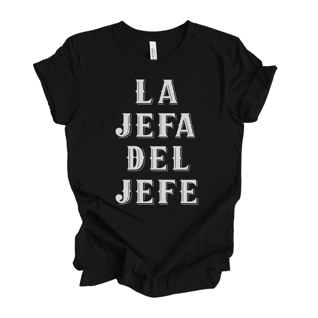 A black t-shirt with a bold graphic that reads "La Jefa Del Jefe"