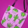 Angled image of a Latina-inspired large tote bag to celebrate Latino culture.  The background is pink and the graphic is cactus themed with a variety of cartoon cacti., with the phrase "know your roots"