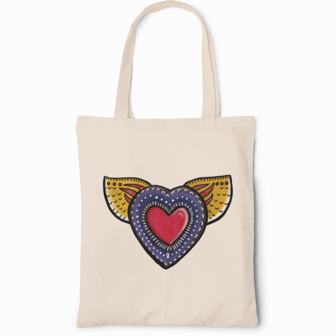 A mexican canvas tote bag featuring a colorful graffiti-style heart with golden wings symbolizing freedom