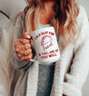 Latina woman holding a Funny tall white mug for taco-lovers. The graphic is a tattoo-style taco with the words "I'm a slut for tacos, a Tac-Ho, if you will"