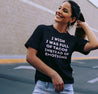 Hispanic woman wearing a Funny black t-shirt that states "I wish I was full of tacos instead of emotions" in vintage pink lettering.