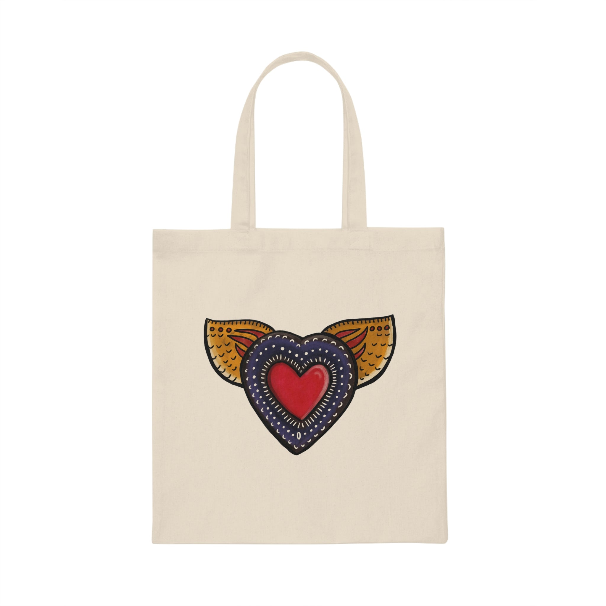 A canvas tote bag displaying a bold and bright graffiti-style heart with golden wings, symbolizing the idea of freedom