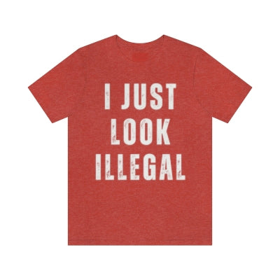 Funny t-shirt for Mexican and Hispanic men, featuring the graphic 'I Just Look Illegal' in street style on a red shirt